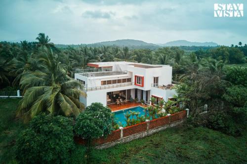 StayVista at Azure Bliss with Huge Pool, BBQ, Wi-Fi