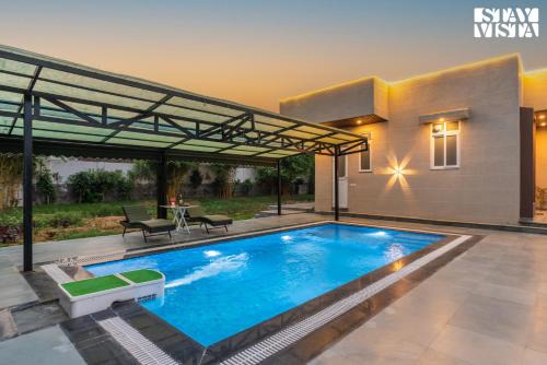 StayVista at The Mira House with Pool, WiFi