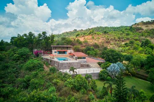 StayVista's Lake Mansion - Lakeside Villa with Mountain View, Large Pool & Sprawling Lawn