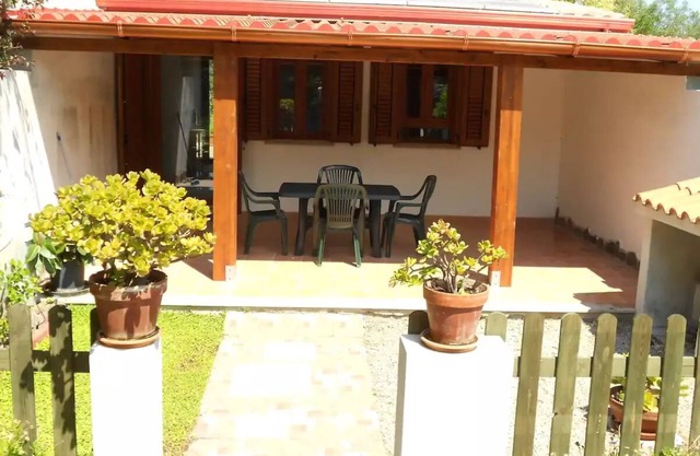 Studio apartment with patio in front and back terrace with veranda