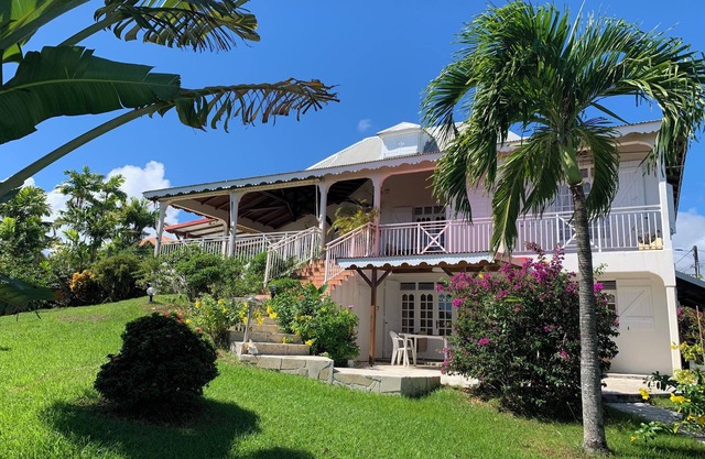 Studio South East, large terrace facing the sea in tropical garden.