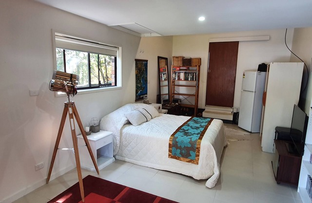 Studio style self contained room, steps to the beach.