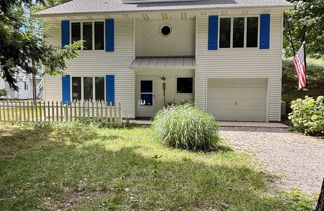 Stunning Lake Michigan Views with 110 Feet Private Beach on One Acre.