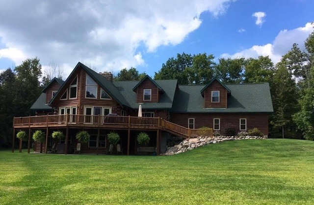 Stunning Log Cabin on 65 Acres with a new swimming pool