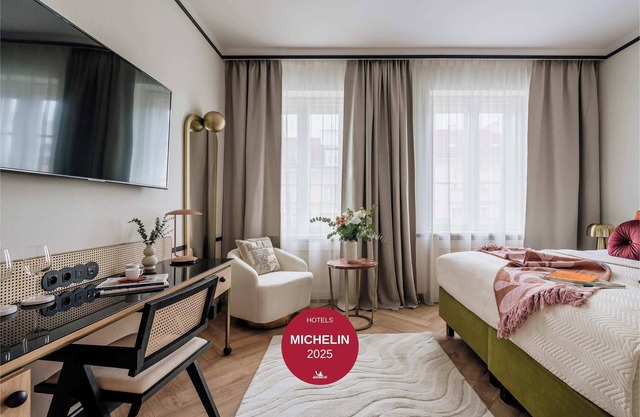 Superior Room with a sofa and Nowy Świat view