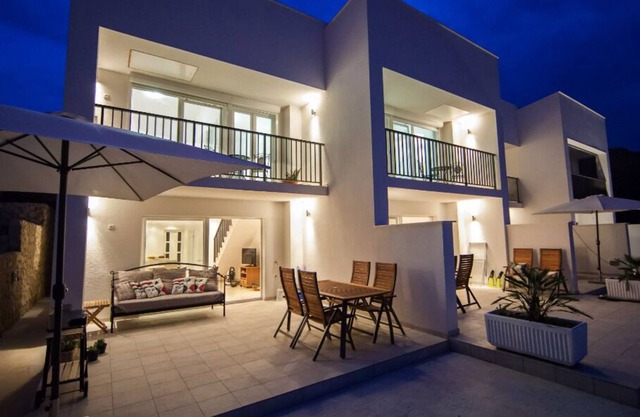 Terrace apartment Neva with heated pool and sea view