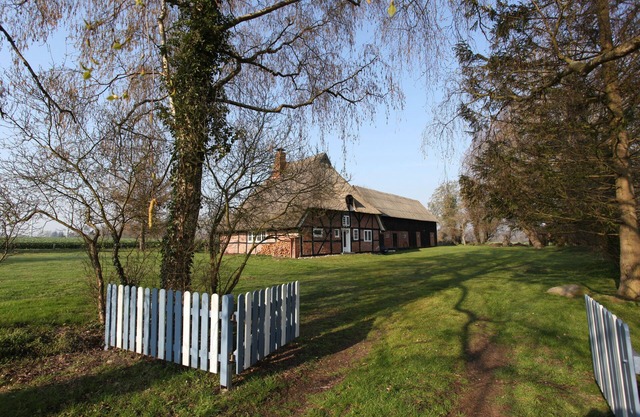 Thatched roof at the edge of the field with a magnificent view