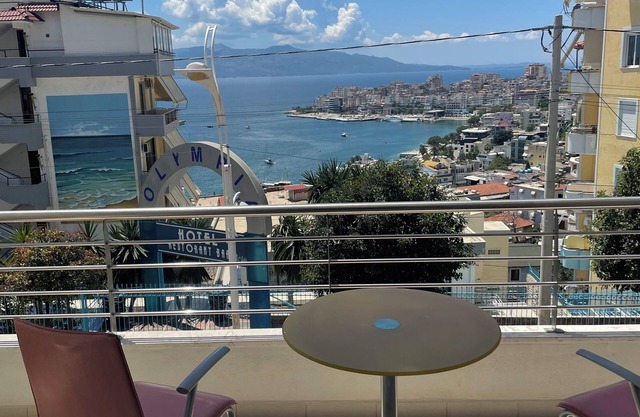 The apartment has a beautiful view of the city and the sea with a balcony.