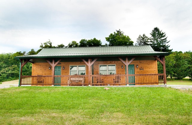 The double cabin has 2 queen beds, 1 king bed, 1 sleep sofa for 1 child. Cabin has common porch and each unit has a private entrance.