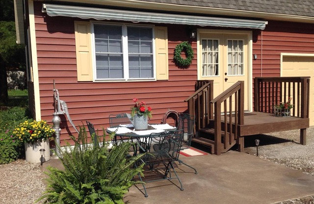 The Little Red Cottage is situated in a quaint country neighborhood