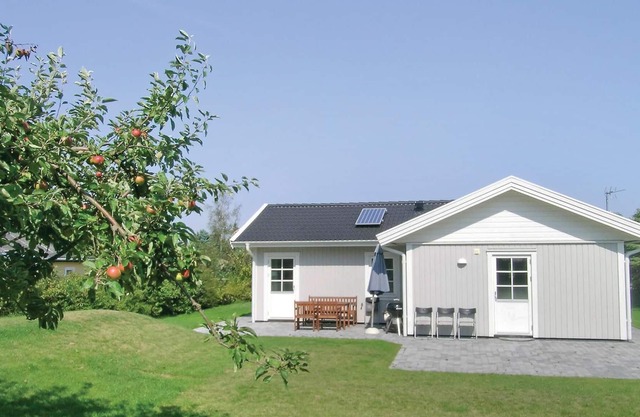 The quality house is located in Mosebølle Strand and in a landscape close to nature.
