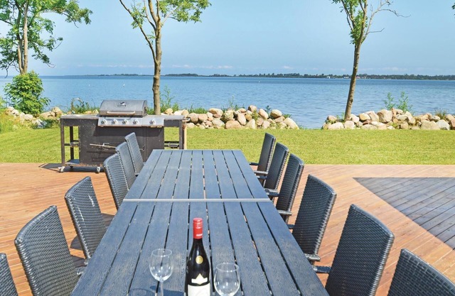 Top house in the first row on the water.