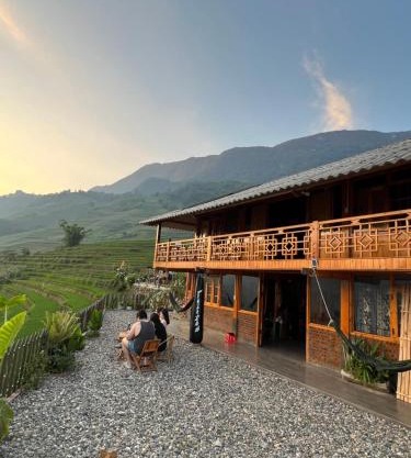 Traditional Hmong House Among Rice Fields