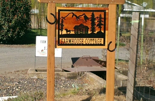 Tranquil setting surrounded by panoramic mountain views, grazing horses