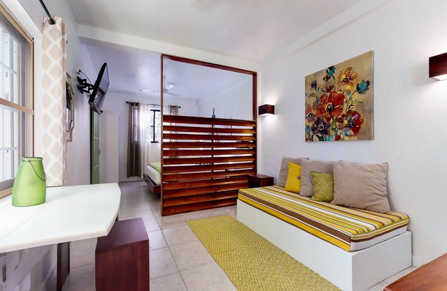 Tropical studio w/patio, WiFi, AC - steps to the sea, water taxis & restaurants