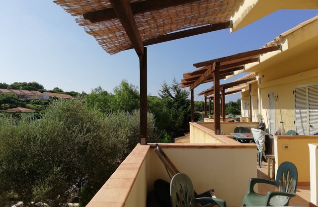 two-level cottage in capopiccolo resort with animation