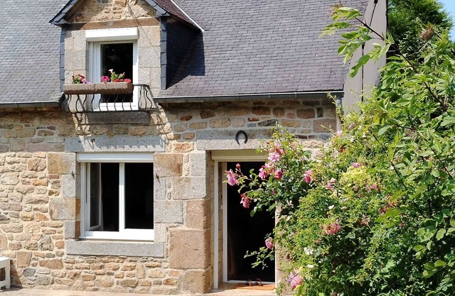 Typical Breton house with garden near the sea and the Bay of Saint Brieuc