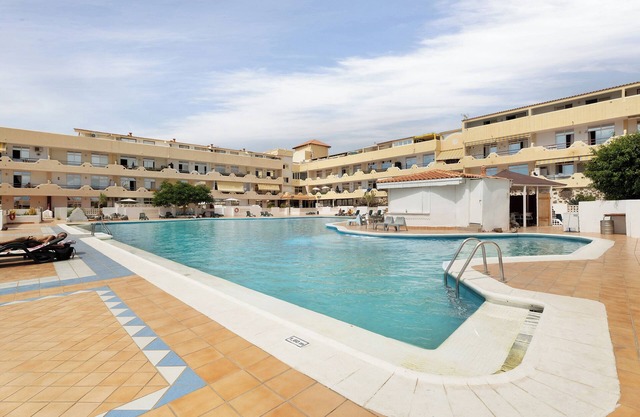 Vacation Home 'Apartmento Palace Playa Paraiso' with Mountain View, Shared Pool, Terrace & Wi-Fi