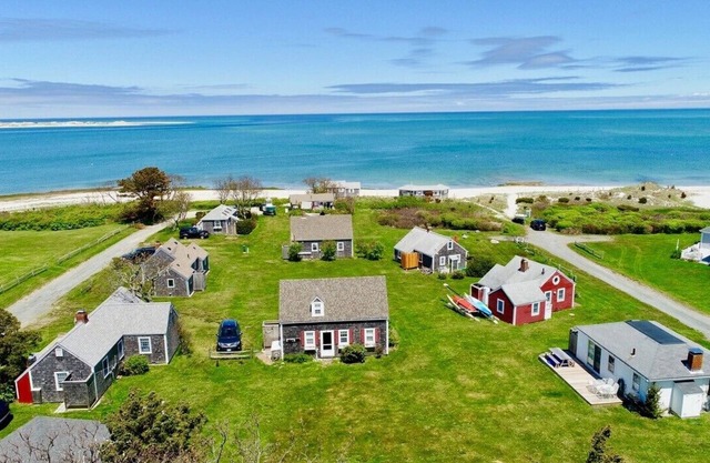 Views across Barnstable Harbor from the deck of this 2 br cottage with access to Association beach.