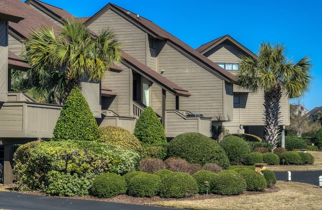 Villa close to ocean with pool access located within gated Litchfield By the Sea community.