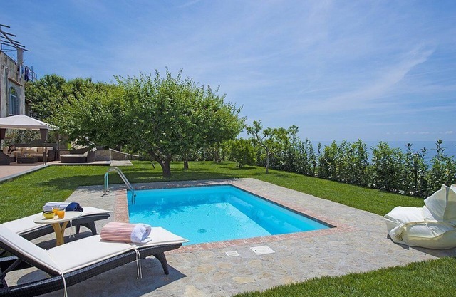 Villa Dorata: A bright and elegant three-story villa built on the sloping cliff in front of the sea, with Free WI-FI.
