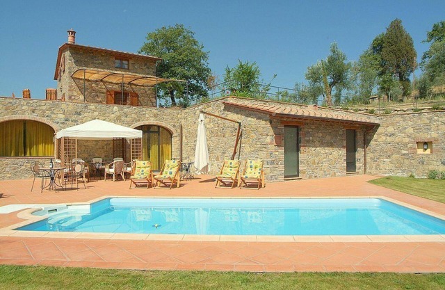 Villa Eracle: A bright and elegant three-story villa surrounded by vineyards and olive groves.