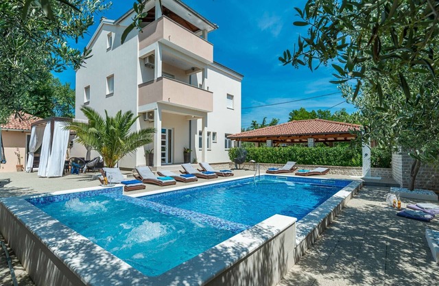 Villa Ines surrounded by vineyards and olive trees
