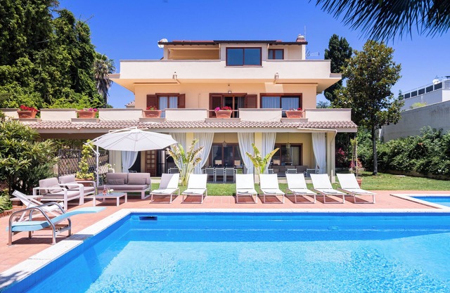 Villa surrounded by greenery with private pool, ideal for families and friends