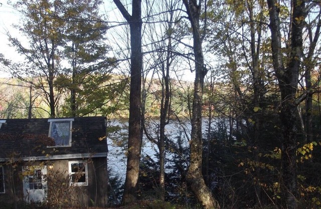 Waterfront Camp looking down on water from deck.