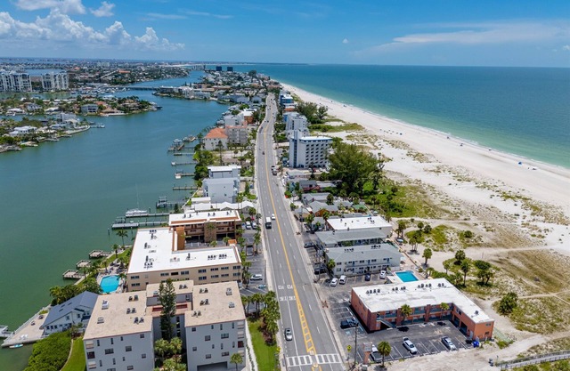 Waterfront Condo Pool Fishing Docks Across from the Beach