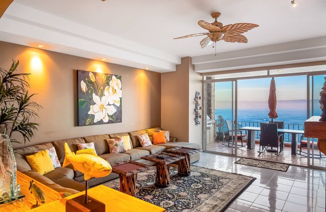 Waterfront condo with heated pool, hot tub, balcony, fireplace, & central AC
