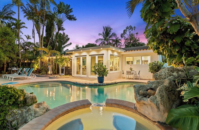 Welcome to Pineapple Paradise, A Spacious Modern Tropical Waterway Home!