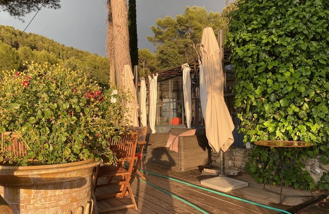 Wine property on a hill surrounded by vineyards and olive trees