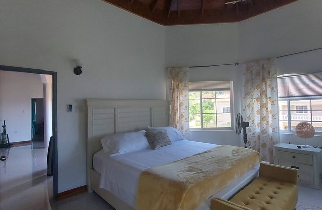 YELLOW SUMMER Luxury cozy villa in Drax Hall, St Ann with roof top lounge.