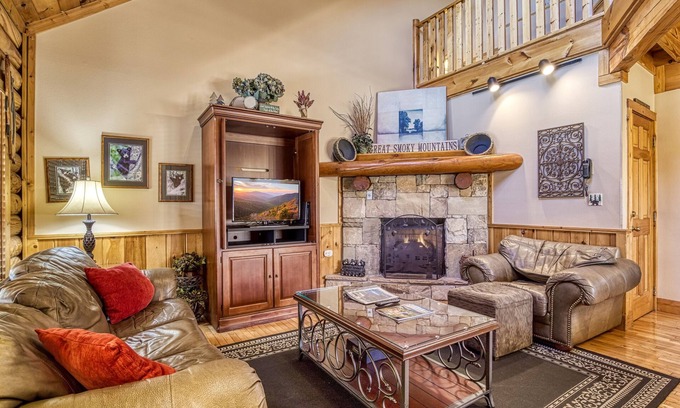 Pigeon Forge House | 1 mile from Pigeon Forge log cabin Townhouse has hot tub with indoor and outdoor pool sleep 8