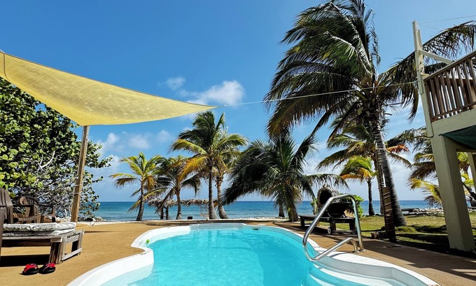 West End House | 2-bd sandy beachfront apt w/pool, cabana, hammocks, sunsets! a tropical dream!