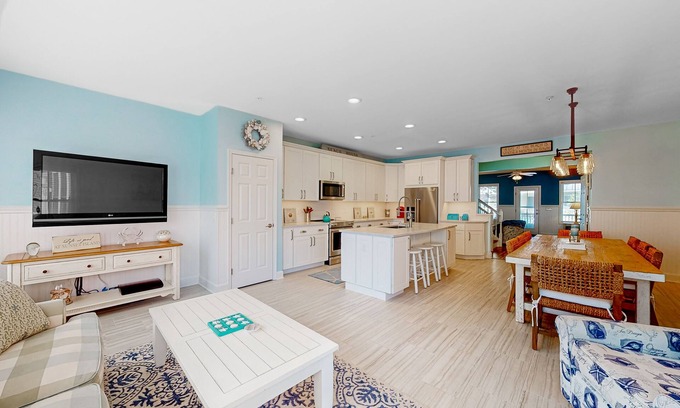 Sunset Island House | 4-story townhome with resort pools, beaches, water access, & great location