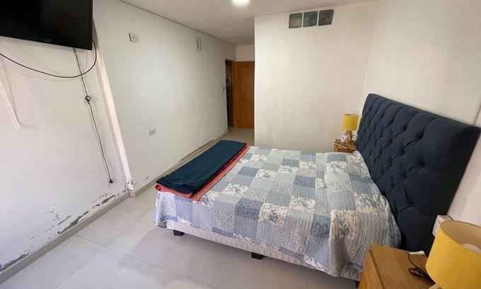 Cordoba House | A bedroom and a bathroom