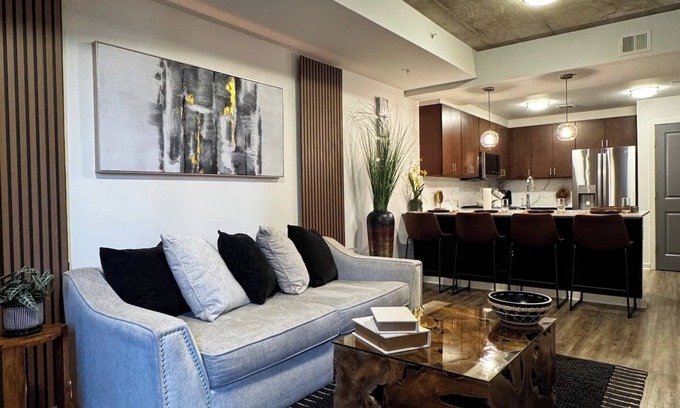 Midtown Apartment | A Place of Peace: Discover serene comfort in a peaceful retreat! This centrally located property provides easy access to top corporations, popular attractions, stadiums, & dining hotspots.