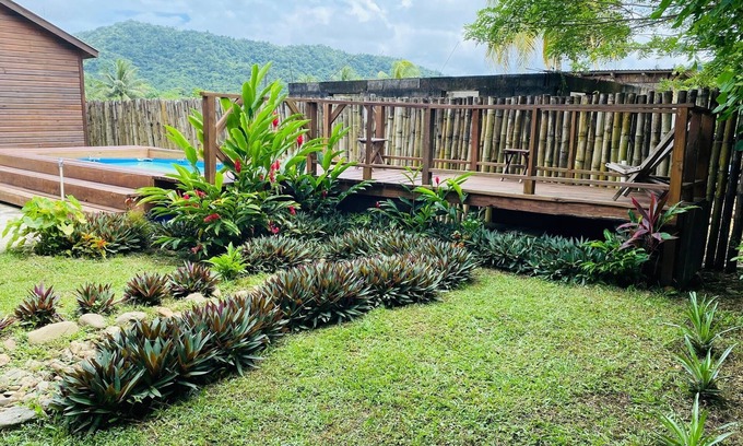 Dangriga Cabin | Aly's Valley Cabin, a private cabin in a village with a mountain view.