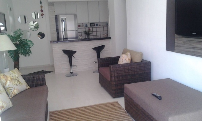 Tombo Apartment | Amplo ap. 62m com sacada,1 dorm. 2 ban. cozinha americana 150m da Praia do Tombo