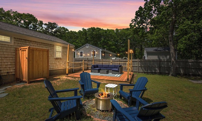 South Dennis House | An elevated Cape Cod escape close to coveted beaches with fully fenced yard, new deck and firepit
