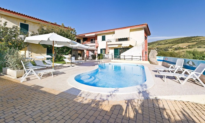 Trinita d'Agultu Apartment | Apartment in complex with swimming pool n. 3 P. earth