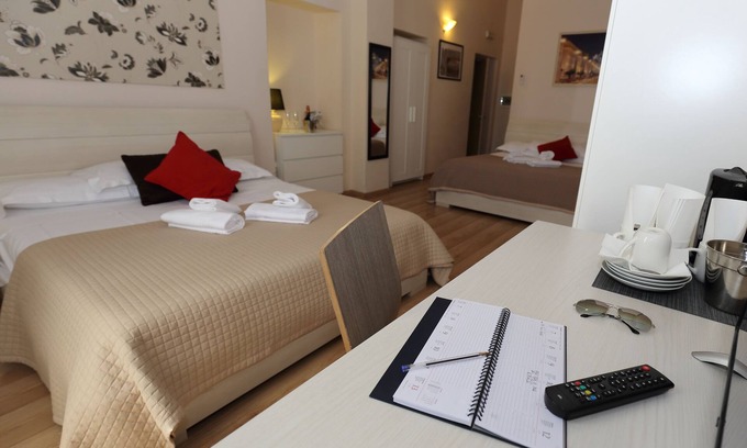 Esquilino Bed & Breakfast | Aria Rome Rooms quadruple room with balcony overlooking Basilica di San Giovanni