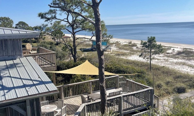 Alligator Point House | BEACH FRONT to BAY with boatdock, swimming pool, pickleball courts and kayaks.