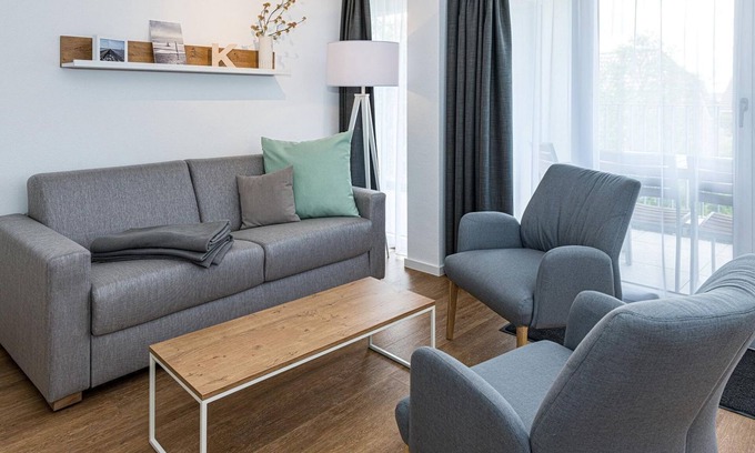 Bensersiel Apartment | Beachfront apartment with large balcony, parking, use of swimming pool & sauna -