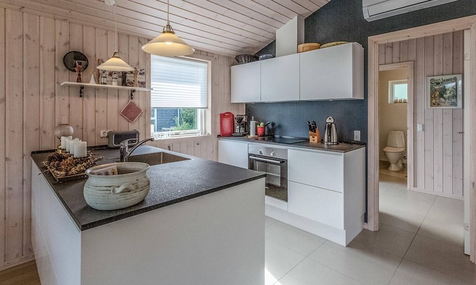 Nykøbing House | Beautiful cottage with kitchen open connection with dining and living room with an alcove.