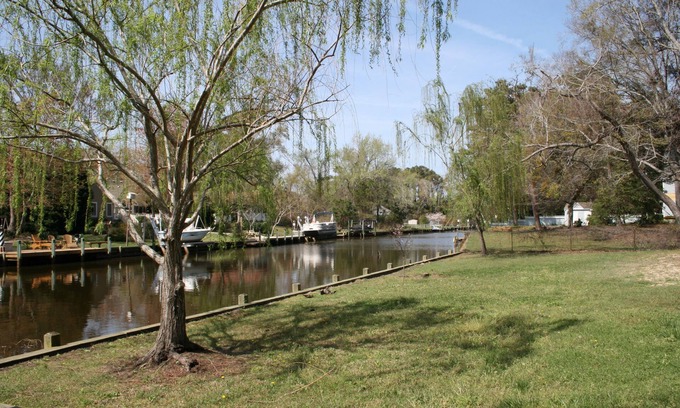 Kitty Hawk House | Beautiful Secluded Canalfront Home. Access to Private Beaches and Marina