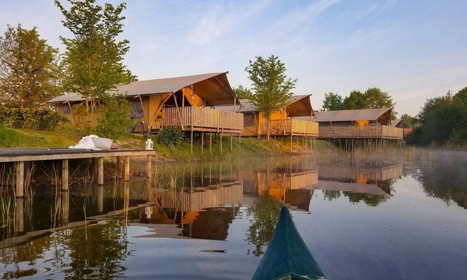 Bant RV Rental | Campsite - Combined Tents With Kitchen and Bathroom Located Near a Pond