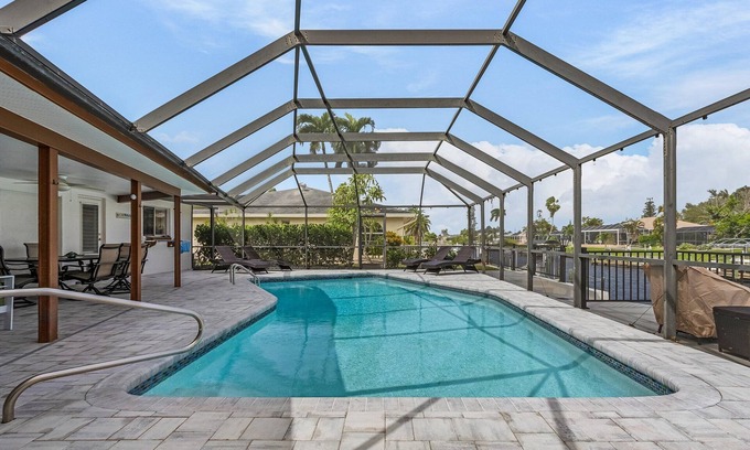 Caloosahatchee House | Cape Coral home w/heated private pool, dock on canal.